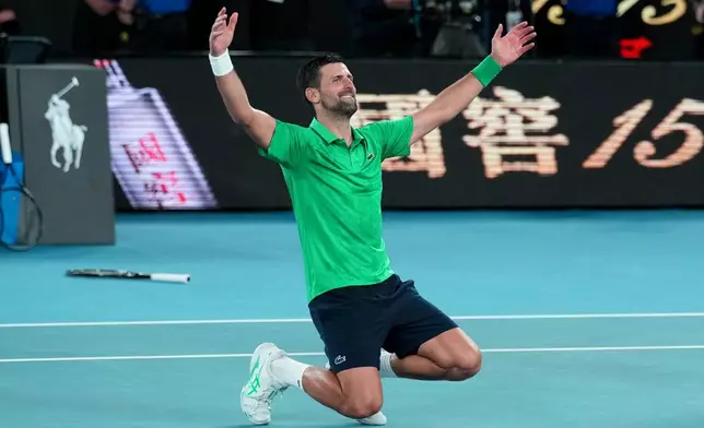 Novak Djokovic of Serbia celebrates after defeating Jannik Sinner of Italy in their semifinal match at the Australian Open tennis championship in Melbourne, Australia, early Saturday, Jan. 31, 2026. (AP Photo/Dita Alangkara)