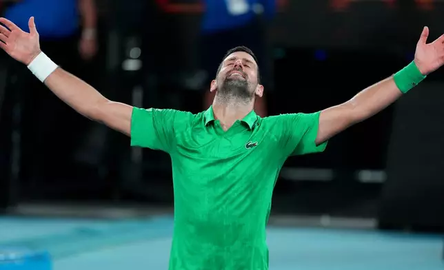 Novak Djokovic of Serbia celebrates after defeating Jannik Sinner of Italy in their semifinal match at the Australian Open tennis championship in Melbourne, Australia, early Saturday, Jan. 31, 2026. (AP Photo/Asanka Brendon Ratnayake)