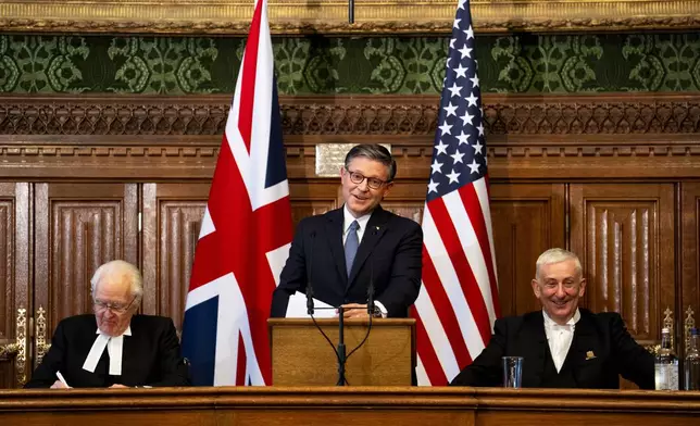 US House Speaker Mike Johnson addresses MPs in the House of Commons alongside Speaker of the House of Lords, Lord McFall, left, and Speaker of the House of Commons Sir Lindsay Hoyle, right, in Westminster, London, Tuesday Jan. 20, 2026. (Jordan Pettitt/Pool Photo via AP)