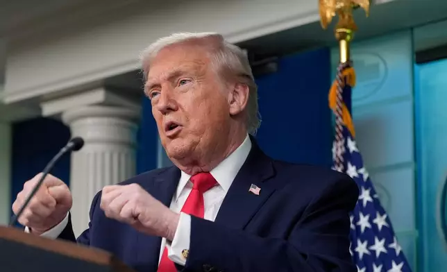 President Donald Trump gestures while he speaks in the James Brady Press Briefing Room at the White House, Tuesday, Jan. 20, 2026, in Washington. (AP Photo/Alex Brandon)