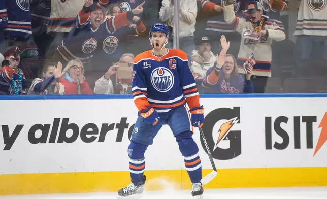 Edmonton Oilers' Connor McDavid (97) celebrates his game-winning goal against the Washington Capitals during overtime NHL action in Edmonton, Alberta, Saturday, Jan. 24, 2026. (Jason Franson/The Canadian Press via AP)