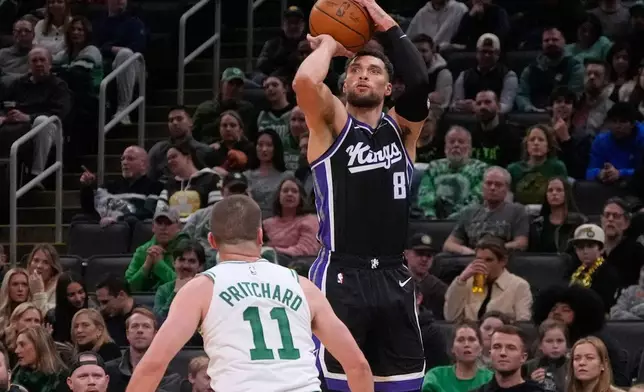 Sacramento Kings guard Zach LaVine (8) looks to shoot over Boston Celtics guard Payton Pritchard (11) during the second half of an NBA basketball game, Friday, Jan. 30, 2026, in Boston. (AP Photo/Charles Krupa)