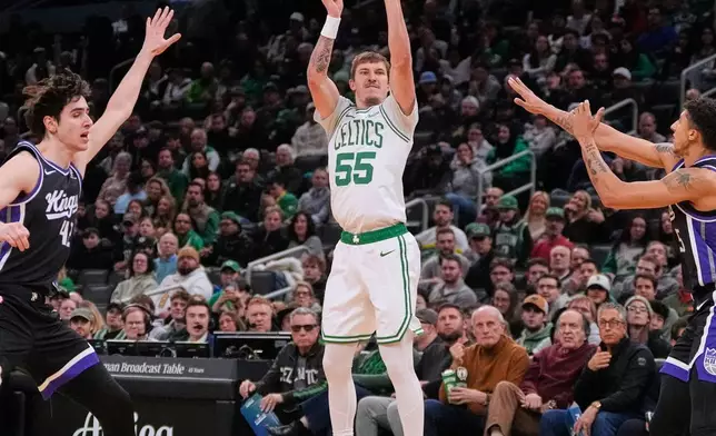 Boston Celtics guard Baylor Scheierman (55) takes a shot against the Sacramento Kings during the first half of an NBA basketball game, Friday, Jan. 30, 2026, in Boston. (AP Photo/Charles Krupa)