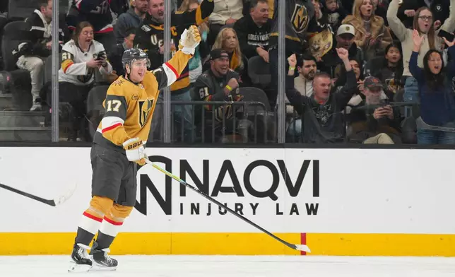 Vegas Golden Knights defenseman Ben Hutton celebrates his goal against the Nashville Predators during the first period of an NHL hockey game, Wednesday, Dec. 31, 2025, in Las Vegas. (AP Photo/Candice Ward)