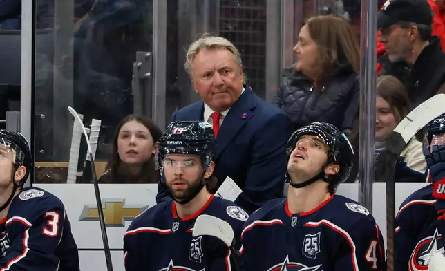 Columbus Blue Jackets head coach Rick Bowness watches his team play against the Calgary Flames during the first period of an NHL hockey game, Tuesday, Jan. 13, 2026, in Columbus, Ohio. (AP Photo/Jay LaPrete)