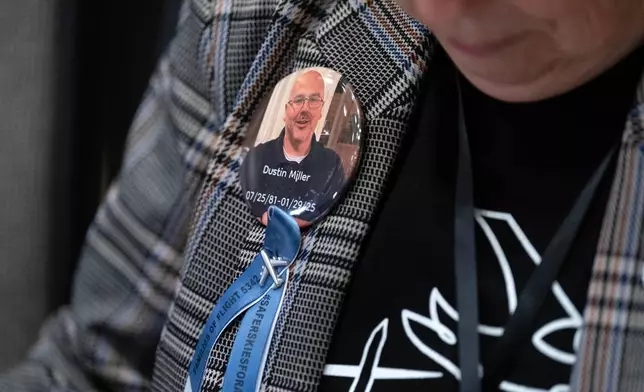 People attend the National Transportation Safety Board (NTSB) hearing on the midair aircraft collision that killed 67 people near Washington Reagan National Airport, at the National Transportation and Safety Board boardroom in Washington, Tuesday, Jan. 27, 2026. (AP Photo/Jose Luis Magana)