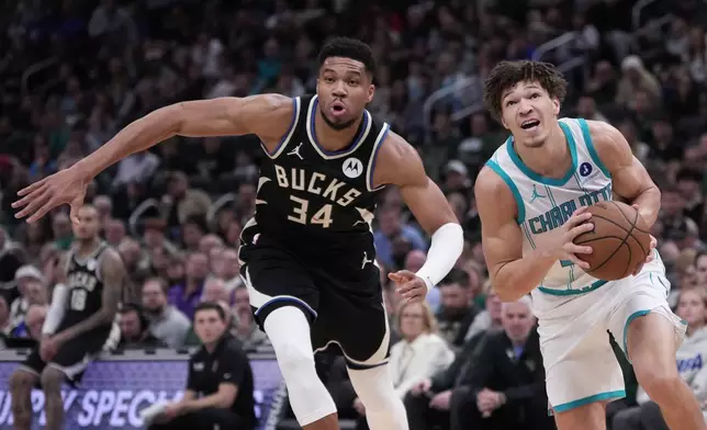Charlotte Hornets forward Tidjane Salaun (31) drives past Milwaukee Bucks guard Andre Jackson Jr. (44) during the first half of an NBA basketball game Friday, Jan. 2, 2026, in Milwaukee. (AP Photo/Morry Gash)