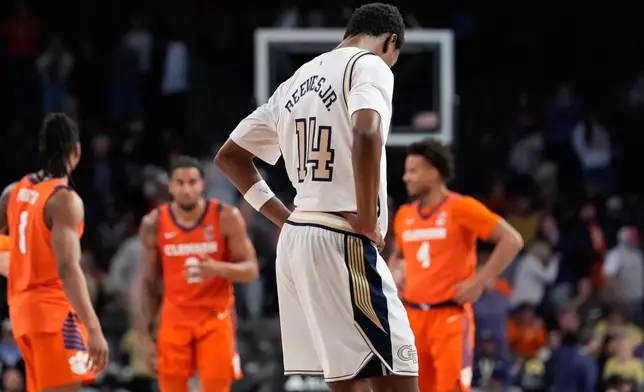 Georgia Tech forward Kowacie Reeves Jr. (14) reacts after a loss during the second half of an NCAA college basketball game against Clemson, Saturday, Jan. 24, 2026, in Atlanta. (AP Photo/Brynn Anderson)