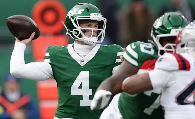 New York Jets quarterback Brady Cook passes against the New England Patriots during the first half of an NFL football game, Sunday, Dec. 28, 2025, in East Rutherford, N.J. (AP Photo/Adam Hunger)