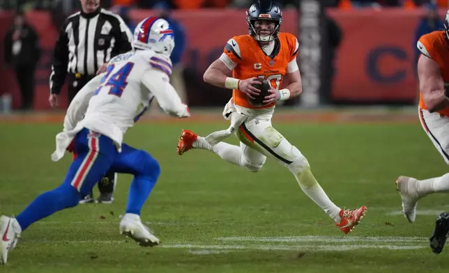 Buffalo Bills safety Cole Bishop, left, pursues Denver Broncos quarterback Bo Nix as he runs for a short gain in overtime of an NFL divisional football game Saturday, Jan. 17, 2026, in Denver. (AP Photo/David Zalubowski)