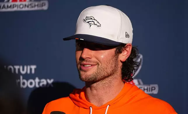 Denver Broncos quarterback Jarrett Stidham responds to questions after an NFL football practice at the team's headquarters Wednesday, Jan. 21, 2026, in Centennial, Colo. (AP Photo/David Zalubowski)