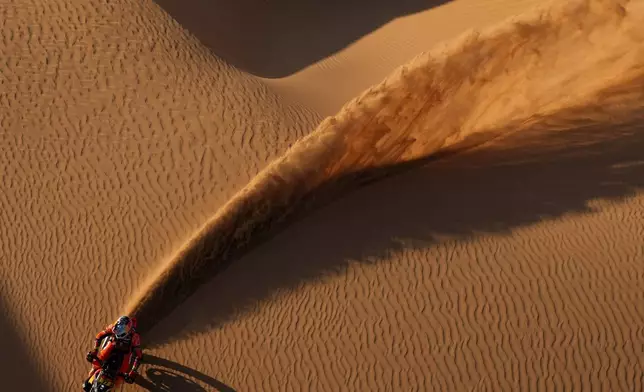 FILE - Rider Luciano Benavides competes in the ninth stage of the Dakar Rally, between Wadi Ad Dawasir and Bisha, Saudi Arabia, Jan.13, 2026. (AP Photo/Thibault Camus, File)