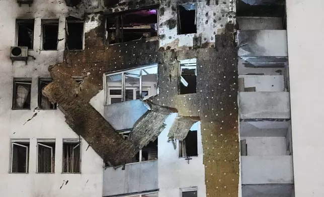 FILE - A view of a residential building damaged by a Russian strike in Kyiv, Ukraine, Jan. 9, 2026. (AP Photo/Efrem Lukatsky, File)