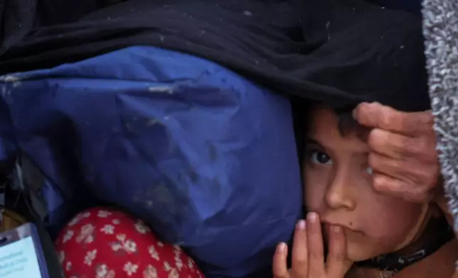 FILE - Displaced residents return to the Achrafieh neighborhood after days of fighting between government forces and Kurdish fighters in Aleppo, Syria, Jan. 12, 2026. (AP Photo/Ghaith Alsayed, File)
