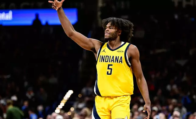 Indiana Pacers forward Jarace Walker gestures during the second half of an NBA basketball game against the Oklahoma City Thunder, Friday, Jan. 23, 2026, in Oklahoma City. (AP Photo/Gerald Leong)