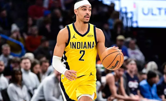 Indiana Pacers guard/forward Andrew Nembhard drives against the Oklahoma City Thunder during the second half of an NBA basketball game Friday, Jan. 23, 2026, in Oklahoma City. (AP Photo/Gerald Leong)