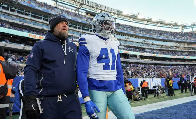 Dallas Cowboys defensive end Donovan Ezeiruaku (41) leaves the game after being disqualified during the third quarter of an NFL football game against the New York Giants, Sunday, Jan. 4, 2026, in East Rutherford, N.J. (AP Photo/Frank Franklin II)