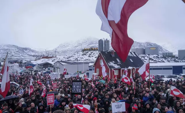 People protest against Trump's policy towards Greenland in front of the US consulate in Nuuk, Greenland, Saturday, Jan. 17, 2026. (AP Photo/Evgeniy Maloletka)