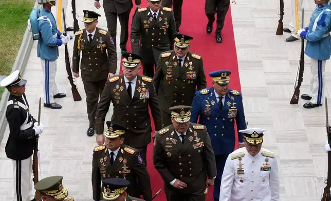 Military leaders arrive at the National Assembly where acting President Delcy Rodriguez addresses lawmakers in Caracas, Venezuela, Thursday, Jan. 15, 2026. (AP Photo/Ariana Cubillos)