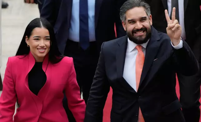 National Assembly lawmaker Nicolas Maduro Guerra, son of deposed President Nicolas Maduro, and his wife Grysell Torres arrive at the National Assembly for Venezuela’s acting President Delcy Rodriguez first state of the union address in Caracas, Venezuela, Thursday, Jan. 15, 2026. (AP Photo/Ariana Cubillos)