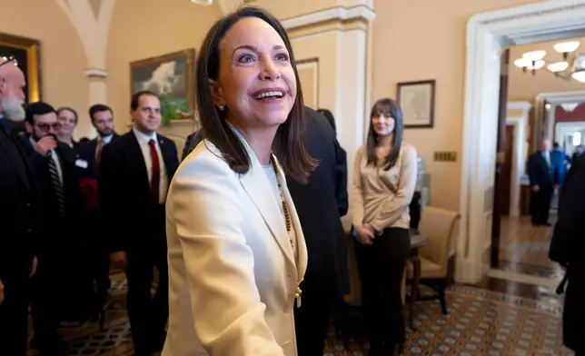 Venezuelan opposition leader Maria Corina Machado is welcomed as she arrives for meetings in the office of Sen. Dick Durbin, D-Ill., the ranking member of the Senate Judiciary Committee at the Capitol in Washington, Thursday, Jan. 15, 2026. (AP Photo/J. Scott Applewhite)