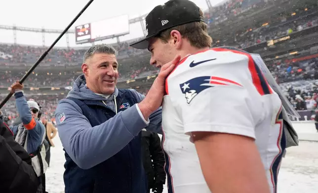 New England Patriots head coach Mike Vrabel speaks with quarterback Drake Maye after the AFC Championship NFL football game against the Denver Broncos, Sunday, Jan. 25, 2026, in Denver. (AP Photo/Ashley Landis)