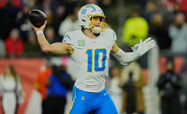 Los Angeles Chargers quarterback Justin Herbert (10) passes in the first half of an NFL wild-card playoff football game against the New England Patriots, in Foxborough, Mass., Sunday, Jan. 11, 2026. (AP Photo/Robert F. Bukaty)