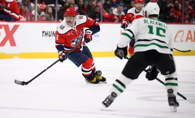 Washington Capitals left wing Alex Ovechkin (8) skates with the puck against Dallas Stars center Colin Blackwell (15) during the first period of an NHL hockey game, Wednesday, Jan. 7, 2026, in Washington. (AP Photo/Nick Wass)