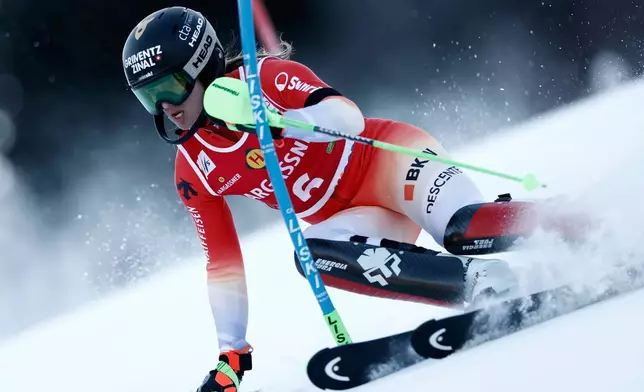 Switzerland's Camille Rast speeds down the course during an alpine ski, women's World Cup slalom, in Kranjska Gora, Slovenia, Sunday, Jan. 4, 2026. (AP Photo/Gabriele Facciotti)