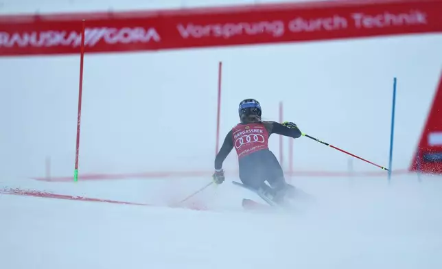 United States' Mikaela Shiffrin speeds down the course during an alpine ski, women's World Cup slalom, in Kranjska Gora, Slovenia, Sunday, Jan. 4, 2026. (AP Photo/Marco Trovati)