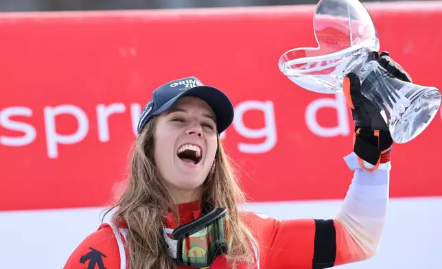 Switzerland's Camille Rast celebrates after winning an alpine ski, women's World Cup slalom, in Kranjska Gora, Slovenia, Sunday, Jan. 4, 2026. (AP Photo/Marco Trovati)