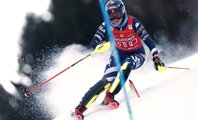 United States' Mikaela Shiffrin speeds down the course during an alpine ski, women's World Cup slalom, in Kranjska Gora, Slovenia, Sunday, Jan. 4, 2026. (AP Photo/Gabriele Facciotti)