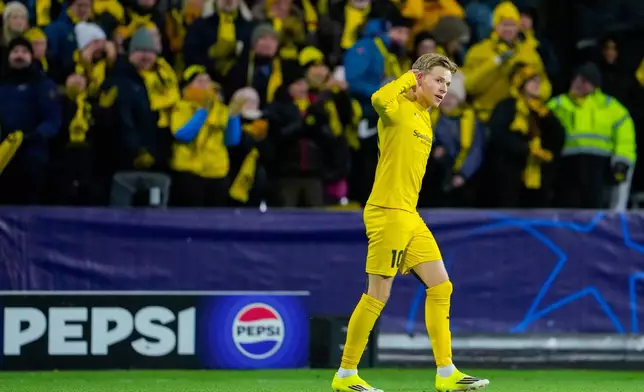 Glimt's Jens Petter Hauge celebrates after scoring during the Champions League soccer match between Bodo/Glimt and Manchester City in Bodo, Norway, Tuesday, Jan. 20, 2026. (Fredrik Varfjell/NTB via AP)