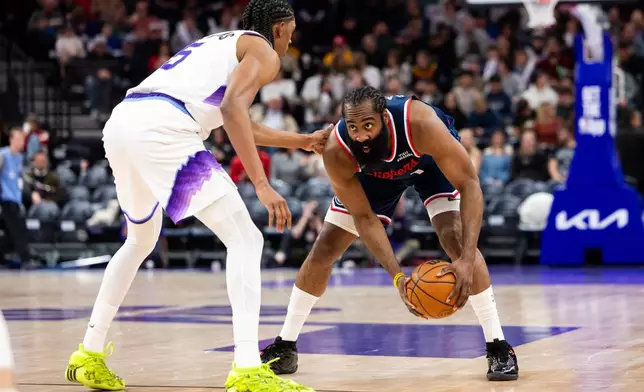Utah Jazz forward Cody Williams, left, defends Los Angeles Clippers guard James Harden, right, during the second half of an NBA basketball game, Tuesday, Jan. 27, 2026, in Salt Lake City. (AP Photo/Anna Fuder)