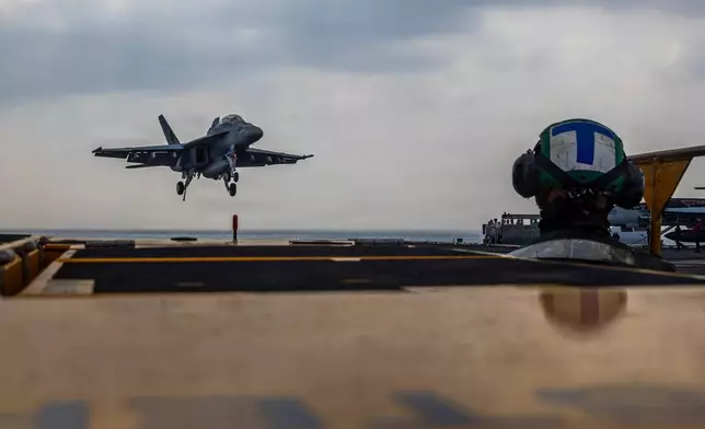 This photo provided by the U.S. Navy shows a Boeing F/A-18E Super Hornet landing on the Nimitz-class aircraft carrier USS Abraham Lincoln in the Indian Ocean on Jan. 22, 2026. (Mass Communication Specialist Seaman Daniel Kimmelman/U.S. Navy via AP)