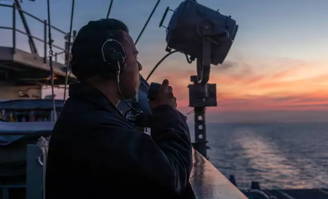 This photo provided by the U.S. Navy shows Seaman Rafael Brito standing watch aboard the Nimitz-class aircraft carrier USS Abraham Lincoln in the Indian Ocean on Jan. 22, 2026. (Mass Communication Specialist Seaman Angel Campbell/U.S. Navy via AP)