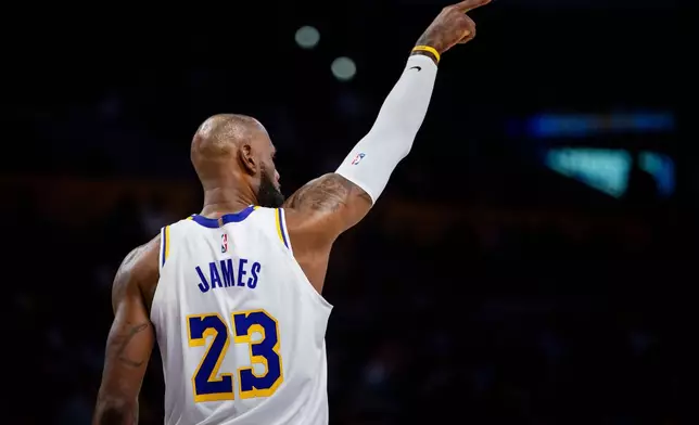 Los Angeles Lakers forward LeBron James (23) gestures during the first half of an NBA basketball game against the Memphis Grizzlies Sunday, Jan. 4, 2026, in Los Angeles. (AP Photo/Ethan Swope)