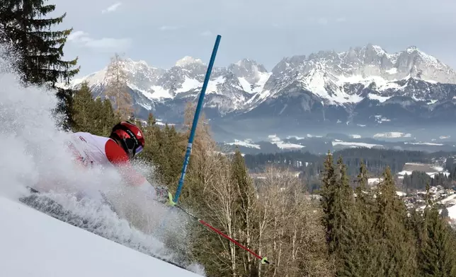 Switzerland's Loic Meillard speeds down the course during an alpine ski, men's World Cup slalom in Kitzbuehel, Austria, Sunday, Jan. 25, 2026. (AP Photo/Gabriele Facciotti)