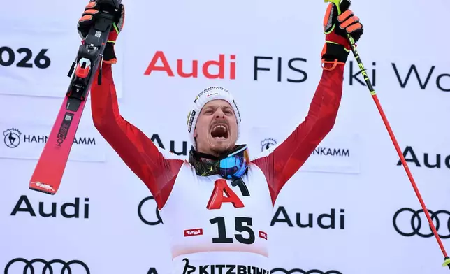 Austria's Manuel Feller celebrates winning an alpine ski, men's World Cup slalom in Kitzbuehel, Austria, Sunday, Jan. 25, 2026. (AP Photo/Marco Trovati)