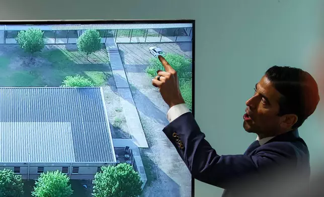 Defense attorney Nico LaHood points to a map of the exterior of Robb Elementary School to show where his client, Adrian Gonzales, parked while cross-examining witness Joe Vasquez, a Zavala County Sheriff's Office deputy, during Gonzales's trial at the Nueces County Courthouse, Tuesday, Jan. 13, 2026, in Corpus Christi, Texas. (Sam Owens/The San Antonio Express-News via AP, Pool)