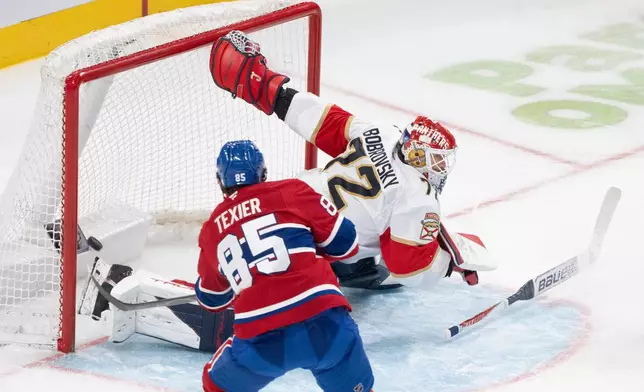 Montreal Canadiens' Alexandre Texier (85) scores on Florida Panthers goaltender Sergei Bobrovsky (72) during the third period of an NHL hockey game in Montreal, Thursday, Jan. 8, 2026. (Christinne Muschi/The Canadian Press via AP)