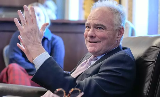 Sen. Tim Kaine, D-Va., speaks to reporters about a war powers resolution regarding Venezuela on Capitol Hill, Wednesday, Jan. 7, 2026, in Washington. (AP Photo/Mariam Zuhaib)