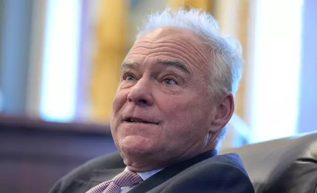 Sen. Tim Kaine, D-Va., speaks to reporters about a war powers resolution regarding Venezuela on Capitol Hill, Wednesday, Jan. 7, 2026, in Washington. (AP Photo/Mariam Zuhaib)