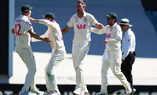 Australia's Beau Webster, second right, celebrates with teammates after dismissing England's Will Jacks during play on day four of the fifth and final Ashes cricket test between England and Australia in Sydney, Wednesday, Jan. 7, 2026. (AP Photo/Mark Baker)