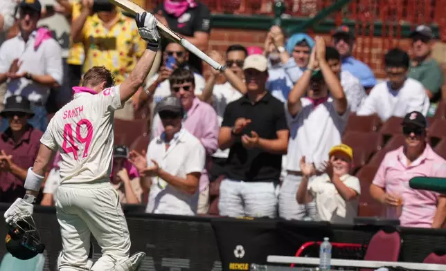 Australia's Steve Smith waves as he leaves the field after he was dismissed during play on day four of the fifth and final Ashes cricket test between England and Australia in Sydney, Wednesday, Jan. 7, 2026. (AP Photo/Mark Baker)