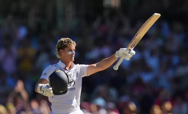 England's Jacob Bethell celebrates after scoring a century during play on day four of the fifth and final Ashes cricket test between England and Australia in Sydney, Wednesday, Jan. 7, 2026. (AP Photo/Mark Baker)