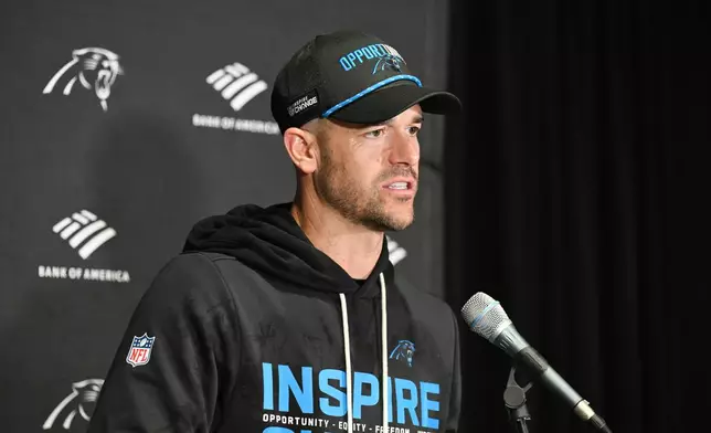 Carolina Panthers head coach Dave Canales answers questions after an NFL football game against the Tampa Bay Buccaneers Saturday, Jan. 3, 2026, in Tampa, Fla. (AP Photo/Jason Behnken)