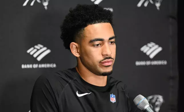 Carolina Panthers quarterback Bryce Young answers questions after an NFL football game against the Tampa Bay Buccaneers Saturday, Jan. 3, 2026, in Tampa, Fla. (AP Photo/Jason Behnken)