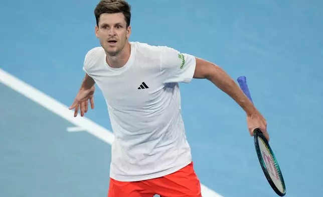 Hubert Hurkacz of Poland celebrates winning the second set against Alex de Minaur of Australia during their quarterfinal match at the United Cup tennis tournament in Sydney, Friday, Jan. 9, 2026. (AP Photo/Rick Rycroft)