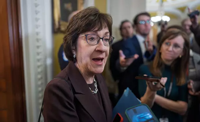 Sen. Susan Collins, R-Maine, chair of the Senate Appropriations Committee, is met by reporters outside the Senate chamber, at the Capitol in Washington, Tuesday, Jan. 6, 2026. (AP Photo/J. Scott Applewhite)